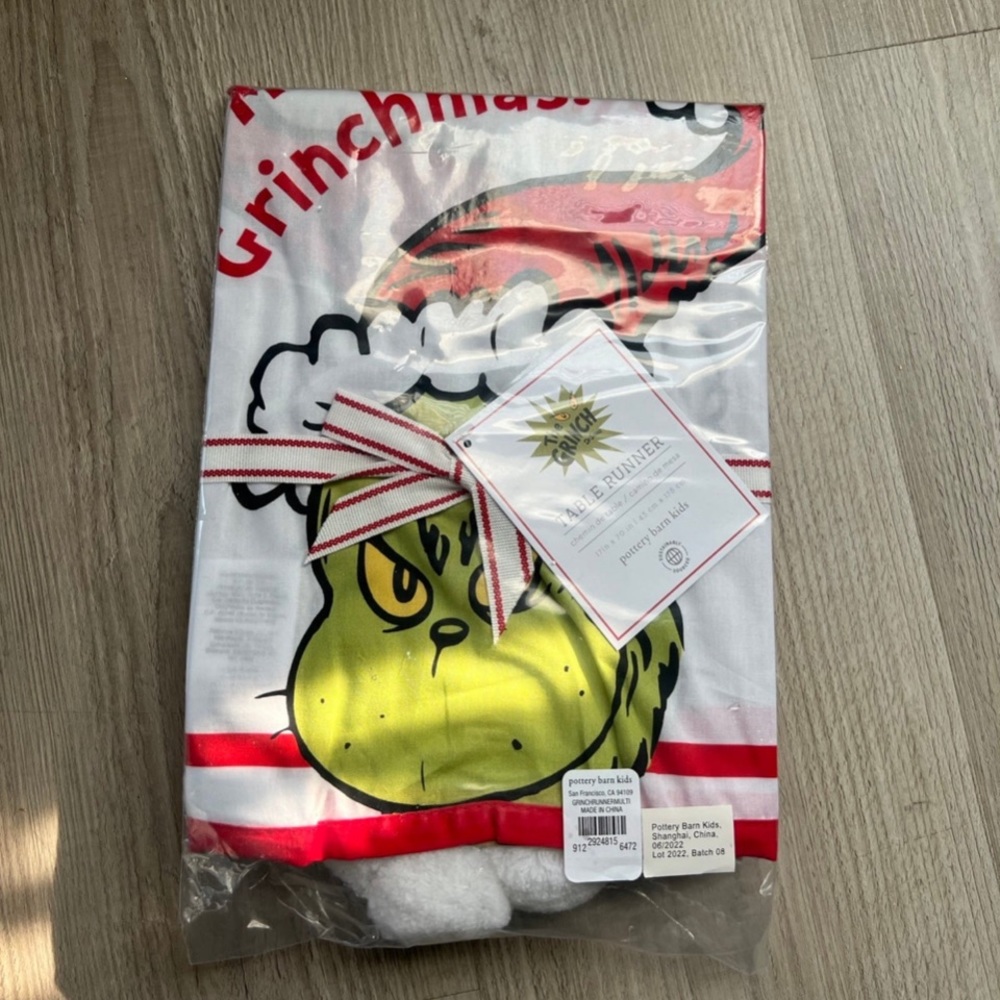 - Brand new The Grinch Table Runner by Pottery Barn Kids